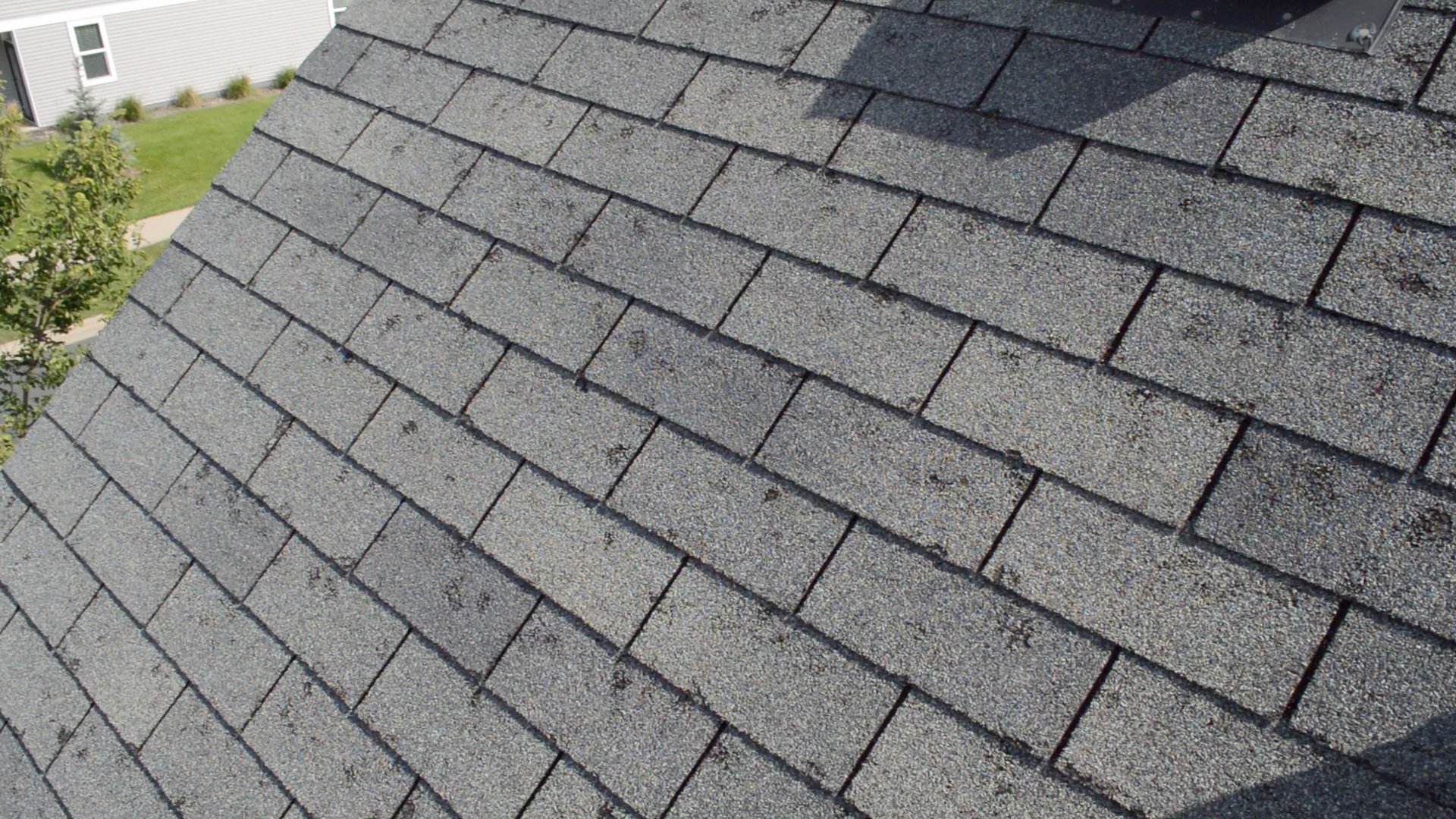 How do I know if I need a roof repair or replacement?